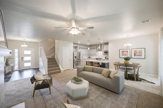 18020 Mounts Farm Rd, Edmond, OK 73012 - living room with a chandelier, stairway, baseboards, recessed lighting, and ceiling fan