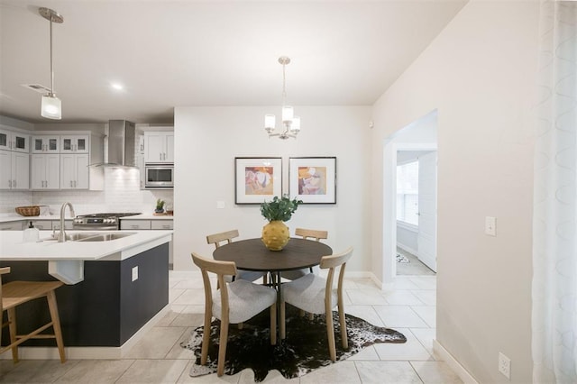 18020 Mounts Farm Rd, Edmond, OK 73012 - dining space featuring a chandelier, light tile patterned floors, and baseboards