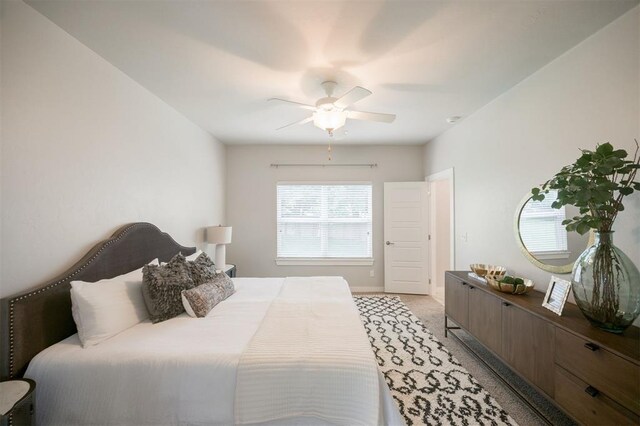 18020 Mounts Farm Rd, Edmond, OK 73012 - bedroom featuring a ceiling fan, baseboards, and light carpet