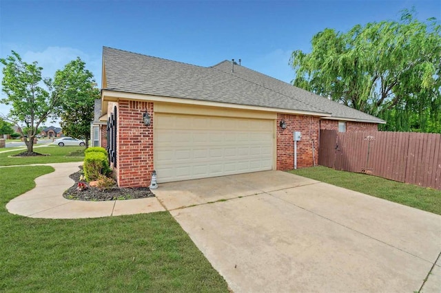 4605 NW 161st St, Edmond, OK 73013 - view of side of home with brick siding, a garage, driveway, and roof with shingles