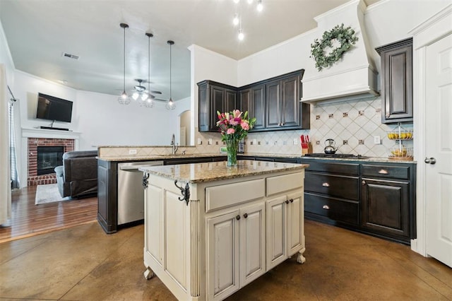 4605 NW 161st St, Edmond, OK 73013 - kitchen featuring stainless steel appliances, custom exhaust hood, open floor plan, backsplash, and a peninsula