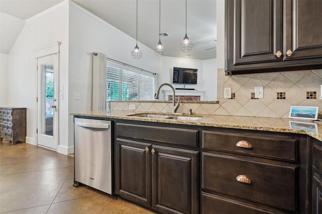 4605 NW 161st St, Edmond, OK 73013 - kitchen with stainless steel dishwasher, a sink, dark brown cabinets, light stone counters, and tasteful backsplash