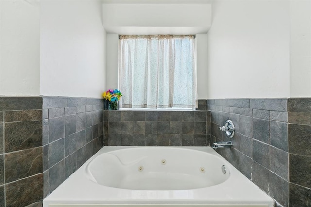 4605 NW 161st St, Edmond, OK 73013 - bathroom with a whirlpool tub and tile walls