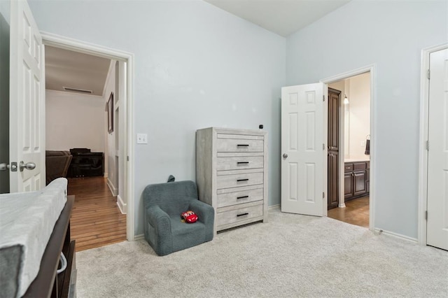 4605 NW 161st St, Edmond, OK 73013 - carpeted bedroom with baseboards and ensuite bathroom