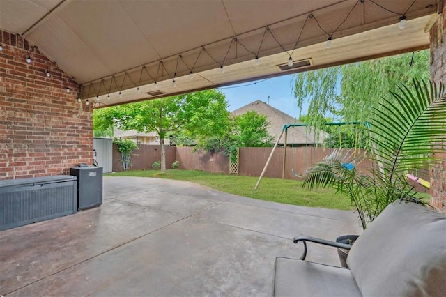 4605 NW 161st St, Edmond, OK 73013 - view of patio / terrace featuring a playground