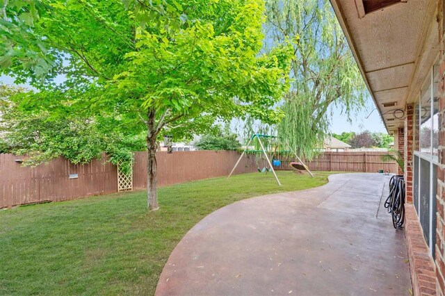 4605 NW 161st St, Edmond, OK 73013 - view of yard featuring a playground and a patio
