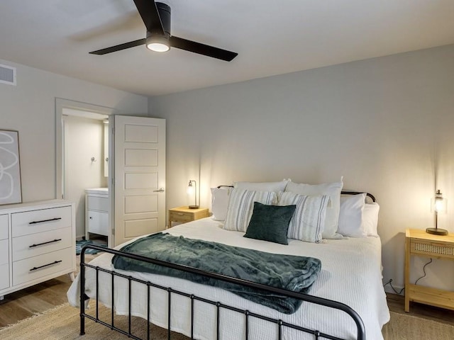 1110 Sherwood Ln Unit 223, Nichols Hills, OK 73116 - bedroom featuring wood finished floors and ceiling fan