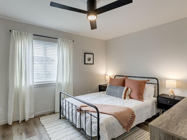 1110 Sherwood Ln Unit 223, Nichols Hills, OK 73116 - bedroom with light wood-type flooring and a ceiling fan
