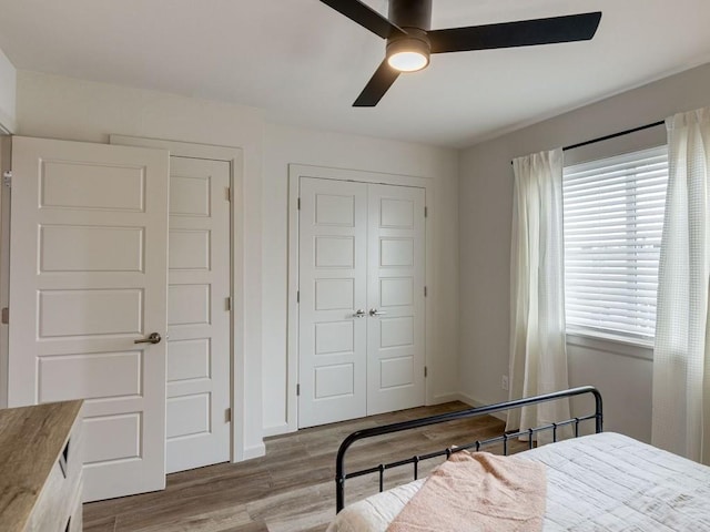 1110 Sherwood Ln Unit 223, Nichols Hills, OK 73116 - bedroom featuring a closet, wood finished floors, and ceiling fan