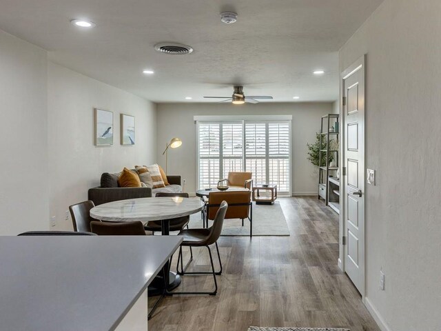 1110 Sherwood Ln Unit 223, Nichols Hills, OK 73116 - dining space featuring ceiling fan, wood finished floors, and recessed lighting