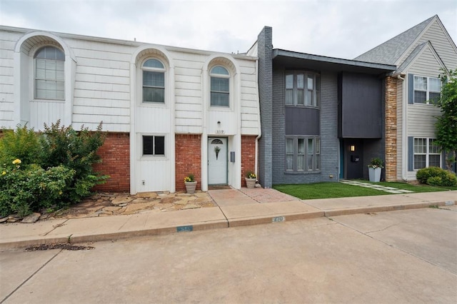 3119 W Wilshire Blvd, Oklahoma City, OK 73116 - view of property featuring brick siding