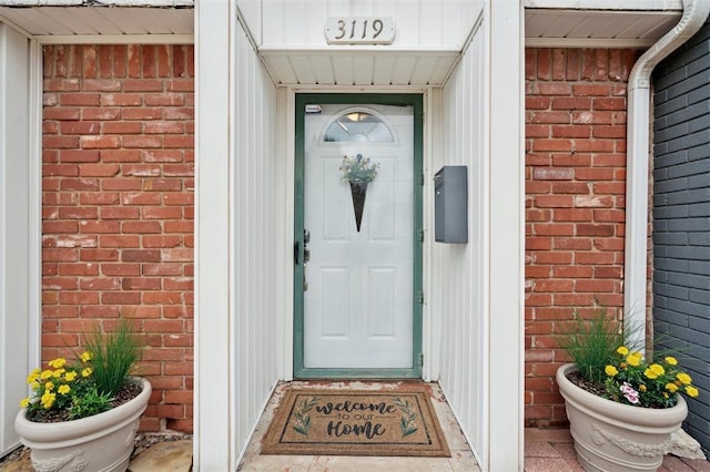 3119 W Wilshire Blvd, Oklahoma City, OK 73116 - doorway to property featuring brick siding