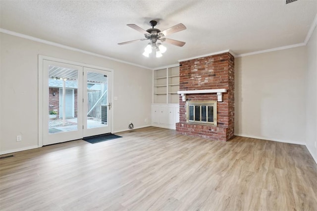 3119 W Wilshire Blvd, Oklahoma City, OK 73116 - unfurnished living room with a textured ceiling, wood finished floors, ceiling fan, ornamental molding, and baseboards