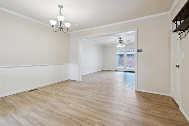 3119 W Wilshire Blvd, Oklahoma City, OK 73116 - unfurnished room with a chandelier, light wood-style flooring, ornamental molding, a textured ceiling, and baseboards