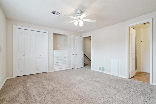 3119 W Wilshire Blvd, Oklahoma City, OK 73116 - unfurnished bedroom with carpet floors, baseboards, ceiling fan, and two closets