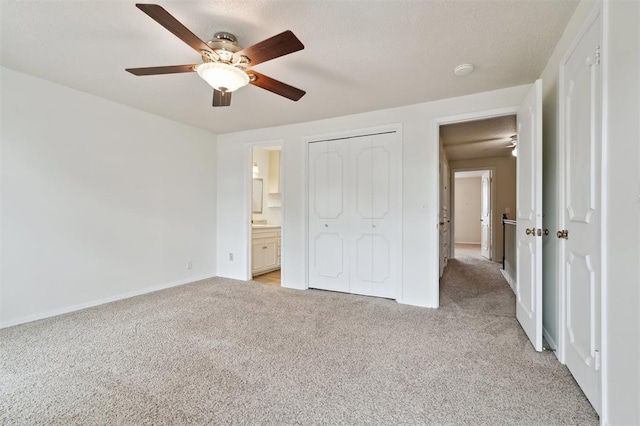 3119 W Wilshire Blvd, Oklahoma City, OK 73116 - unfurnished bedroom featuring light carpet, baseboards, a closet, ceiling fan, and ensuite bath