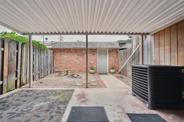3119 W Wilshire Blvd, Oklahoma City, OK 73116 - fenced backyard with cooling unit and a patio area