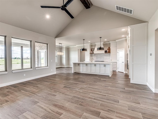 6841 Lake View Ct, Cashion, OK 73016 - unfurnished living room with a ceiling fan, recessed lighting, healthy amount of natural light, high vaulted ceiling, and baseboards