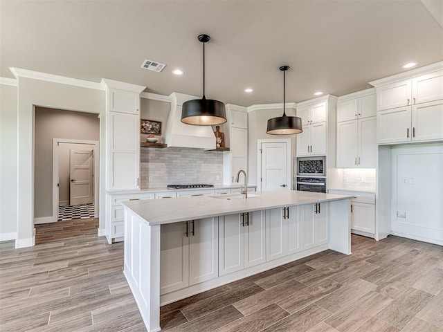 6841 Lake View Ct, Cashion, OK 73016 - kitchen featuring wall oven, white cabinetry, a sink, recessed lighting, and crown molding