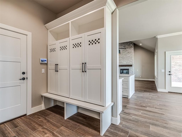 6841 Lake View Ct, Cashion, OK 73016 - mudroom featuring wood finished floors, baseboards, and a stone fireplace
