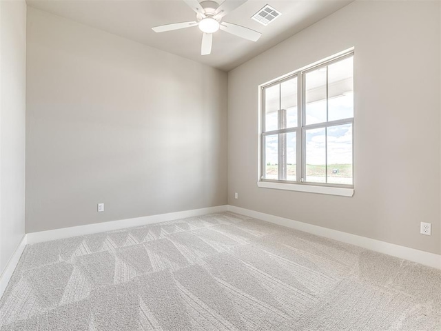 6841 Lake View Ct, Cashion, OK 73016 - unfurnished room with light carpet, baseboards, and ceiling fan
