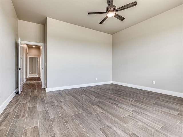 6841 Lake View Ct, Cashion, OK 73016 - empty room with ceiling fan, wood finished floors, and baseboards