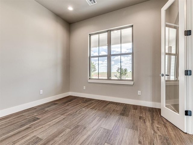 6841 Lake View Ct, Cashion, OK 73016 - unfurnished room with dark wood-type flooring, baseboards, and recessed lighting