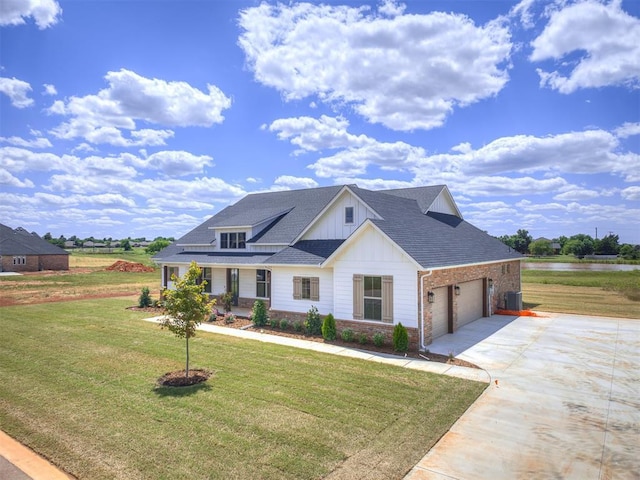 6841 Lake View Ct, Cashion, OK 73016 - modern farmhouse style home featuring board and batten siding, concrete driveway, a front yard, central AC unit, and an attached garage