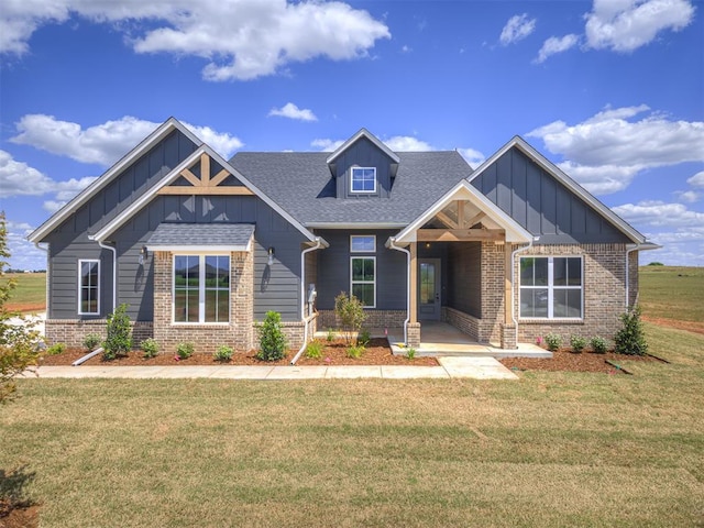 6860 Lake View Ct, Cashion, OK 73016 - craftsman-style house featuring board and batten siding, brick siding, a front lawn, and roof with shingles