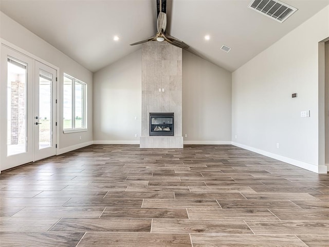 6860 Lake View Ct, Cashion, OK 73016 - unfurnished living room with a ceiling fan, high vaulted ceiling, wood finished floors, baseboards, and a fireplace