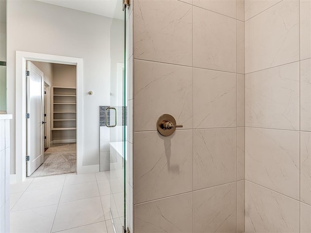 6860 Lake View Ct, Cashion, OK 73016 - bathroom featuring a stall shower, tile patterned floors, and a spacious closet