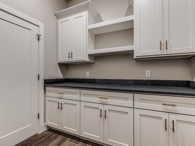 6860 Lake View Ct, Cashion, OK 73016 - kitchen featuring open shelves, dark countertops, dark wood-type flooring, and white cabinetry