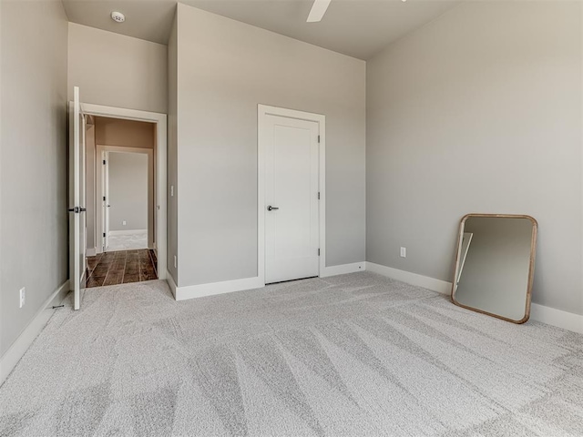 6860 Lake View Ct, Cashion, OK 73016 - unfurnished bedroom featuring carpet floors, baseboards, and a ceiling fan