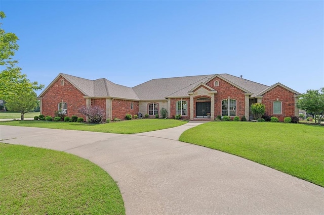 607 Pool Pl, Shawnee, OK 74801 - view of front of property featuring brick siding and a front yard