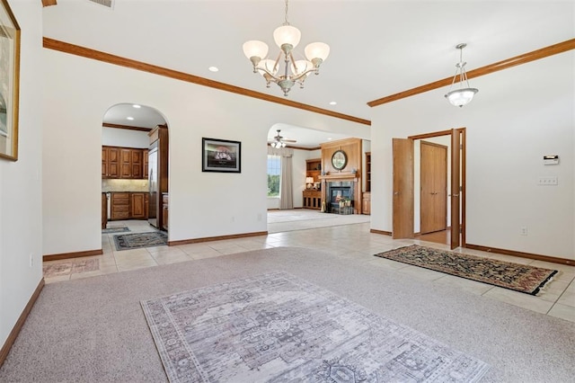 607 Pool Pl, Shawnee, OK 74801 - entryway featuring light tile patterned floors, light colored carpet, arched walkways, ornamental molding, and a chandelier