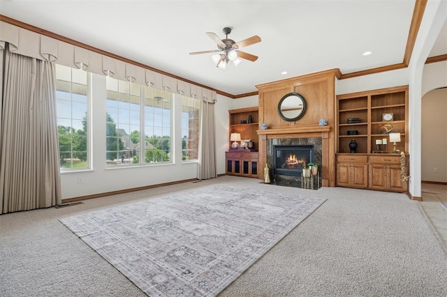 607 Pool Pl, Shawnee, OK 74801 - living room with ornamental molding, light colored carpet, a ceiling fan, and a fireplace