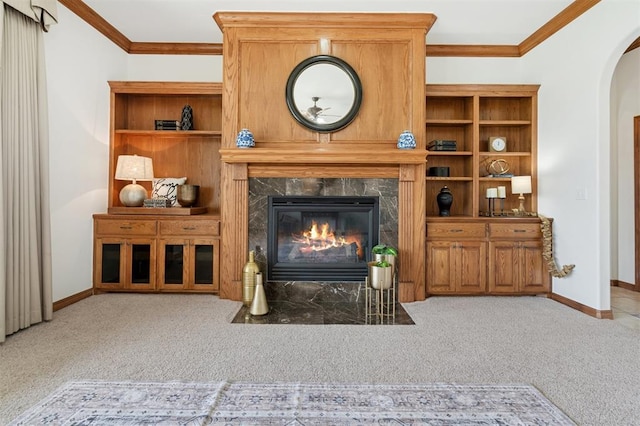 607 Pool Pl, Shawnee, OK 74801 - living room with crown molding, a fireplace, arched walkways, and carpet