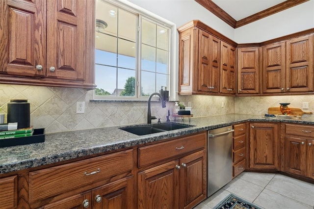 607 Pool Pl, Shawnee, OK 74801 - kitchen with stainless steel dishwasher, crown molding, backsplash, light tile patterned flooring, and brown cabinets