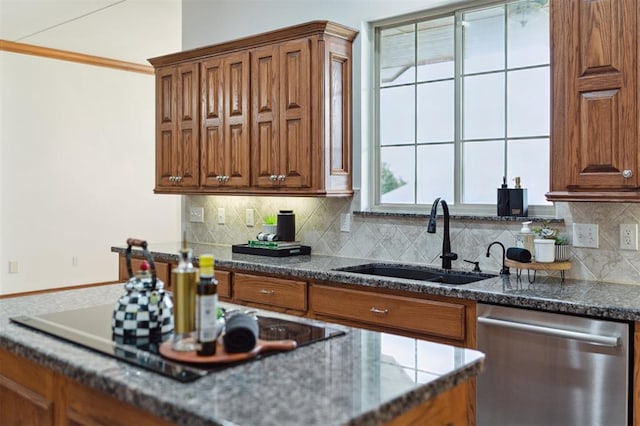 607 Pool Pl, Shawnee, OK 74801 - kitchen with stainless steel dishwasher, black electric cooktop, brown cabinets, and backsplash