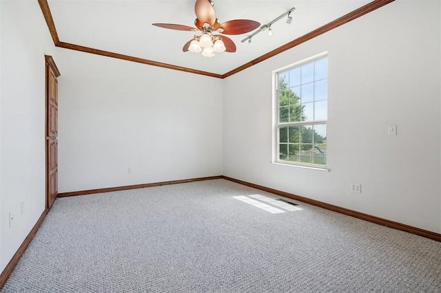 607 Pool Pl, Shawnee, OK 74801 - unfurnished room featuring crown molding, carpet floors, ceiling fan, and rail lighting