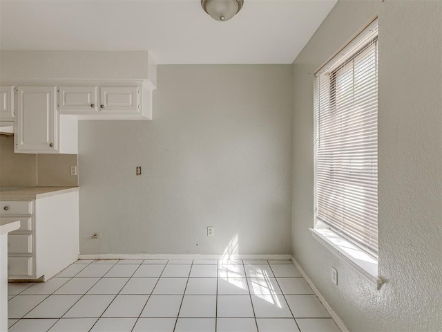 2720 SW 74th St Unit 6, Oklahoma City, OK 73159 - kitchen with plenty of natural light, light countertops, and baseboards