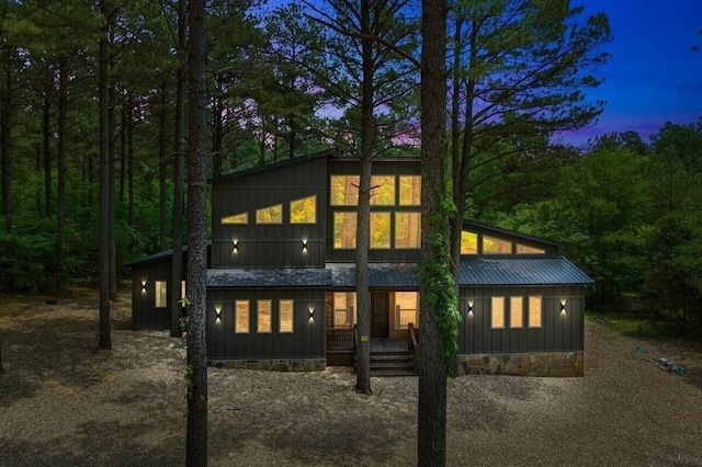 172 Triton Trl, Broken Bow, OK 74728 - rear view of property featuring a porch and board and batten siding