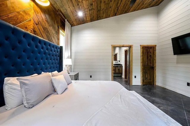 172 Triton Trl, Broken Bow, OK 74728 - bedroom with wooden ceiling, lofted ceiling, wood walls, finished concrete floors, and ensuite bathroom