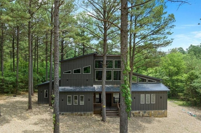172 Triton Trl, Broken Bow, OK 74728 - rear view of property with a porch, a wooded view, and metal roof