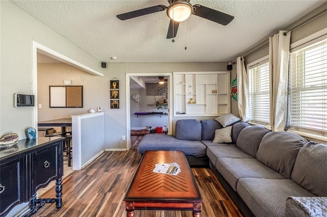 840 NW 14th St, Moore, OK 73160 - living area with a textured ceiling, ceiling fan, and wood finished floors