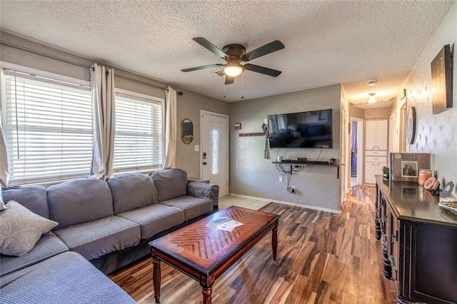 840 NW 14th St, Moore, OK 73160 - living room with wood finished floors, ceiling fan, a textured ceiling, and baseboards