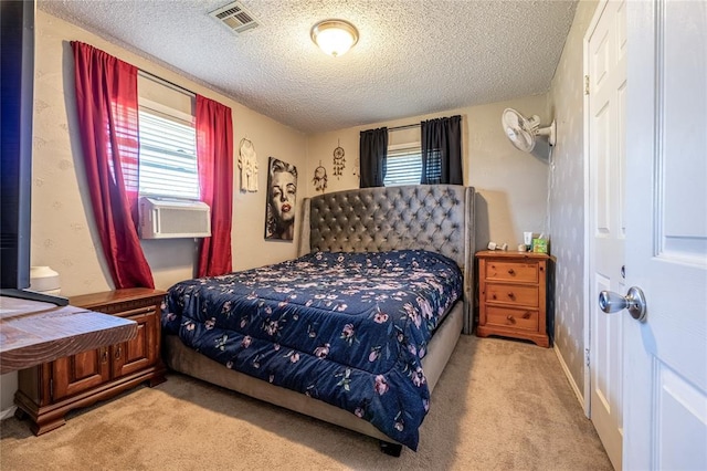 840 NW 14th St, Moore, OK 73160 - carpeted bedroom with cooling unit, multiple windows, and a textured ceiling