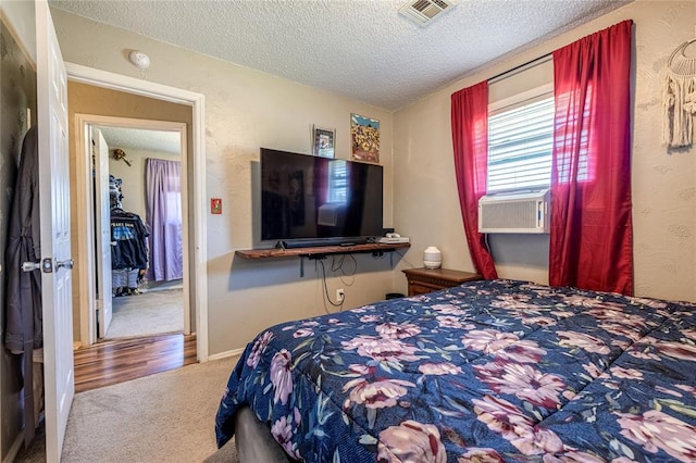 840 NW 14th St, Moore, OK 73160 - bedroom featuring carpet, a textured ceiling, and cooling unit
