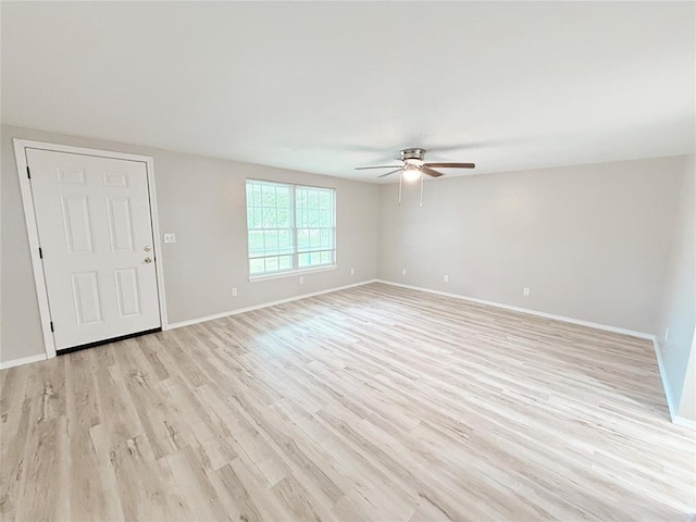 402 E 6th St, Amber, OK 73004 - unfurnished living room with a ceiling fan, light wood finished floors, and baseboards