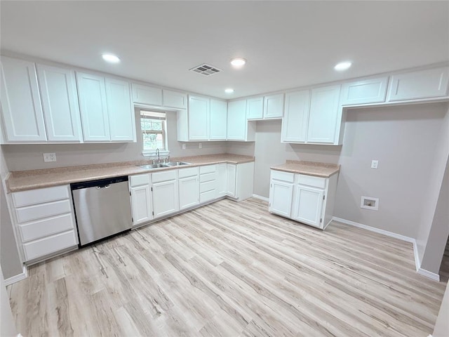402 E 6th St, Amber, OK 73004 - kitchen with dishwasher, a sink, white cabinets, baseboards, and recessed lighting